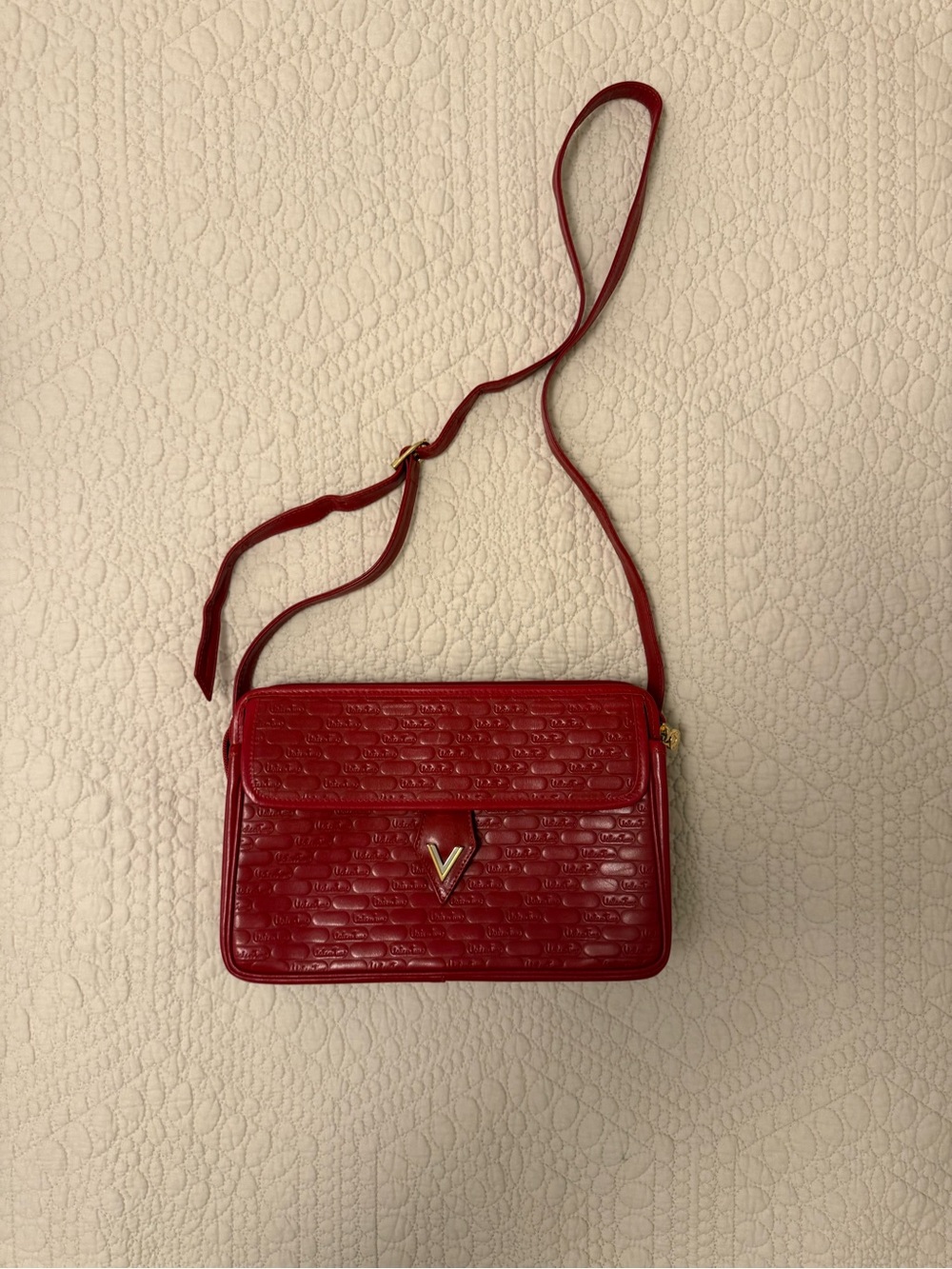 Elegant Red Quilted Crossbody Bag with Gold V Accent